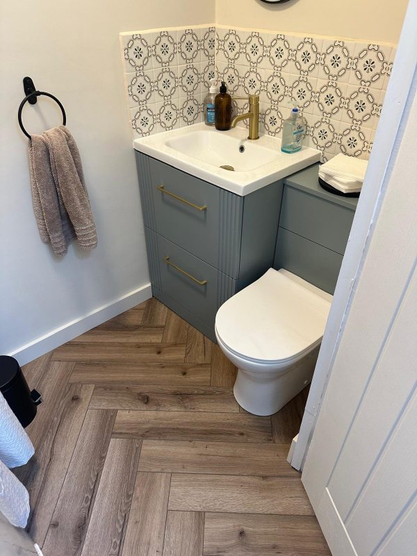 Mocha oak herringbone in beauty salon bathroom