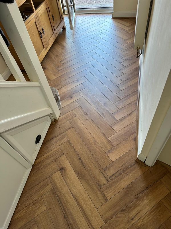 entrance to home with Oak robust fumed herringbone flooring